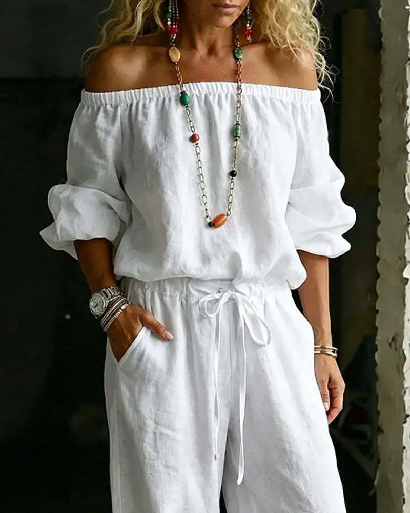 White off-the-shoulder linen jumpsuit with ruffled sleeves and drawstring waist from the linen off-shoulder jumpsuit set.