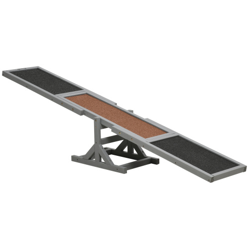 Gray metal dog ramp with black and brown textured surfaces for dog agility seesaw training equipment.