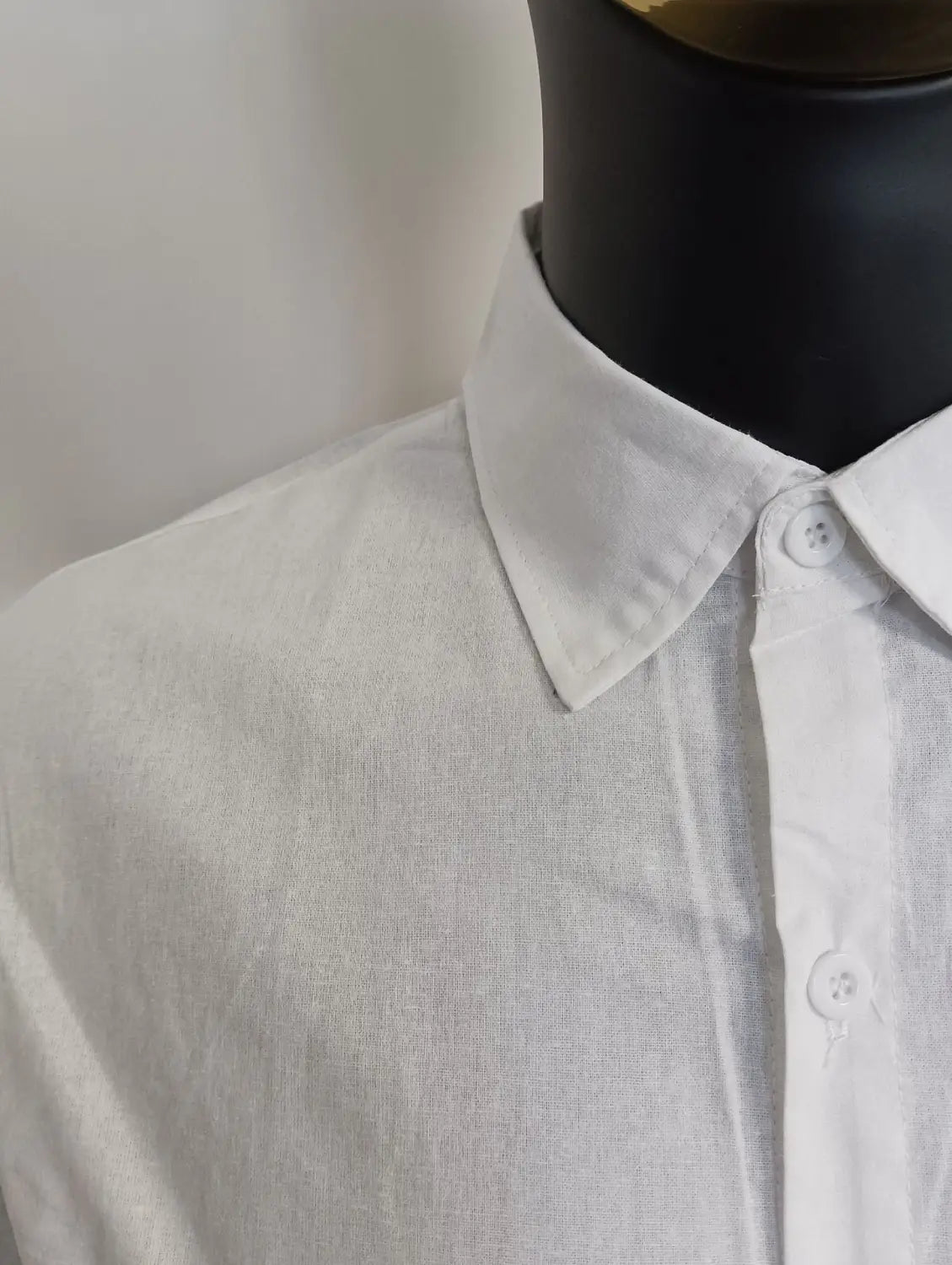 A crisp white linen mens cotton long sleeve casual button down shirt with a classic collar and subtle texture.