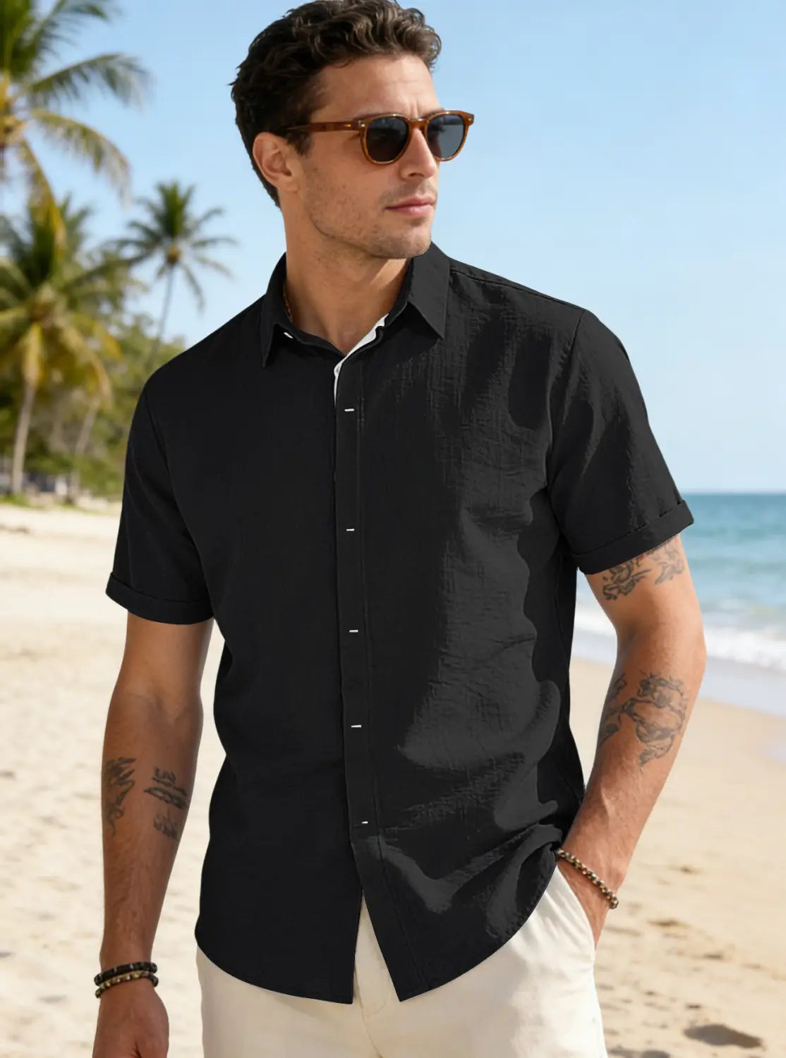 Men’s black textured bamboo linen short sleeve button down shirt with a subtle weave and contrasting white inner collar.