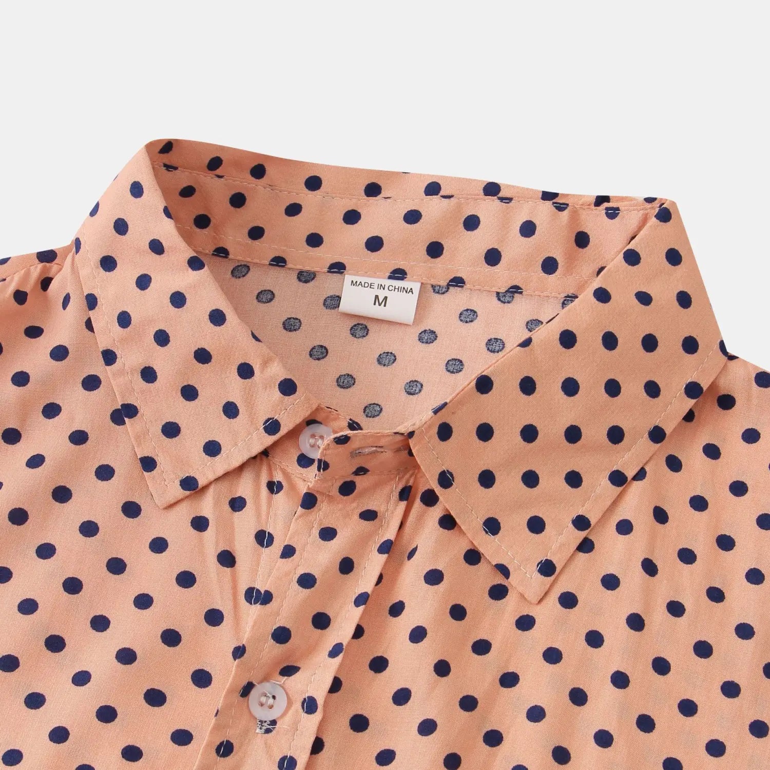 Men plus size button up shirt in peach color with navy blue polka dots and a classic collar.