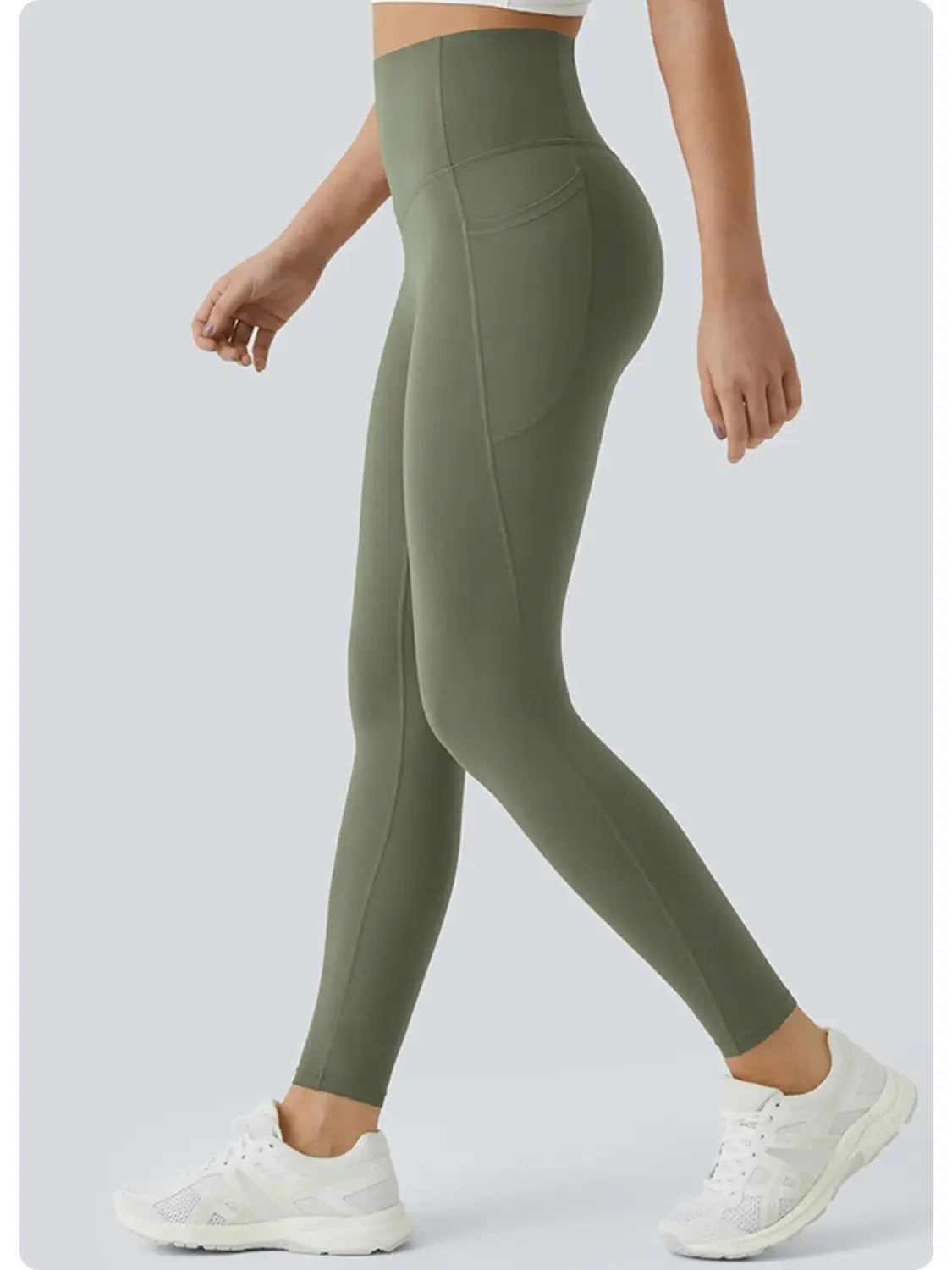 Olivegrüne Yoga-Hose mit hoher Taille und Taschen hinten mit nahtlosem Design und einer Seitentasche für eine praktische Aufbewahrung.