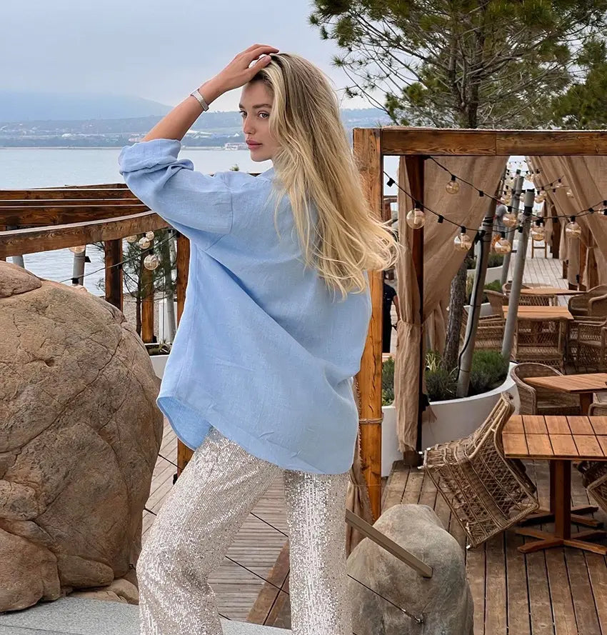 Light blue oversized textured cotton cardigan blouse with rolled-up sleeves for women.