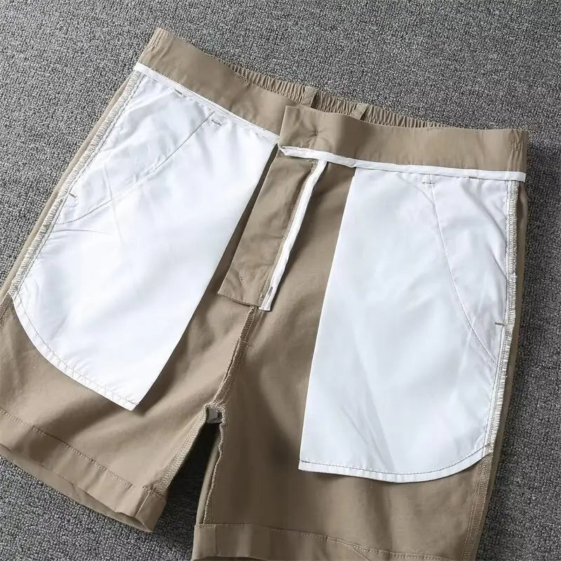 Men casual slim fit cargo shorts in beige with white interior lining and a drawstring waistband.