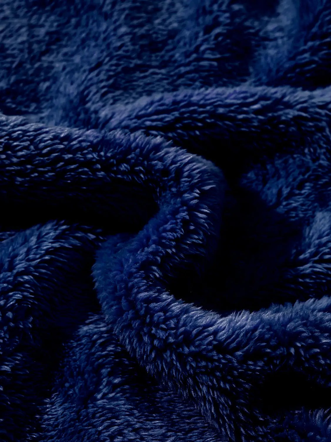 Deep navy blue plush fleece fabric featuring a soft textured surface in a men’s fleece lined loose zip up hooded jacket.