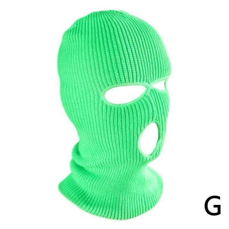 Bonnet cagoule tricoté vert vif à côtes, avec des ouvertures pour les yeux et la bouche, conçu comme un masque chaud pour le cyclisme.
