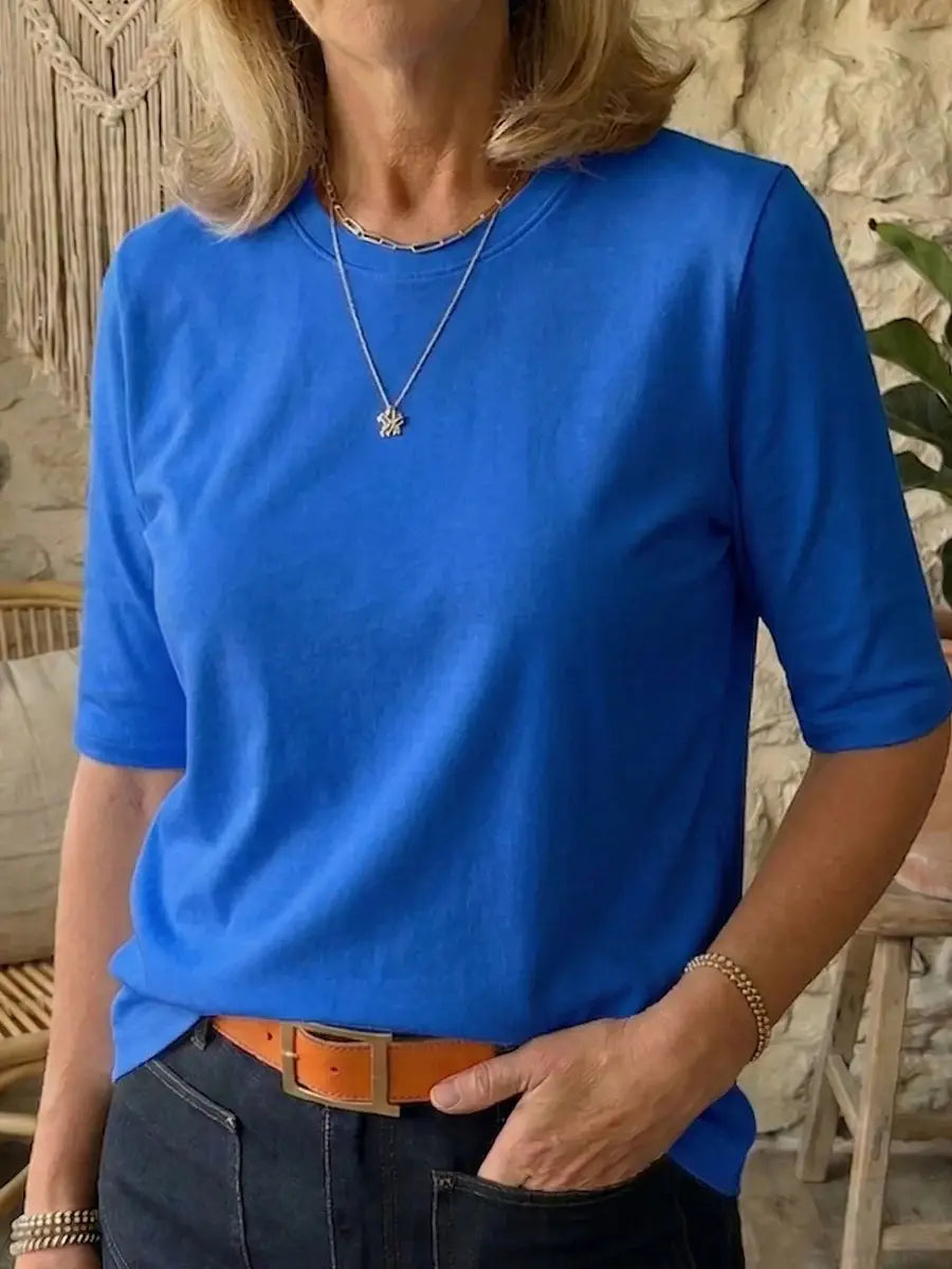 Helles blaues, legeres Pullover-Oberteil mit Rundhalsausschnitt aus Baumwolle mit kurzen Ärmeln, lockerer Passform und rundem Halsausschnitt.