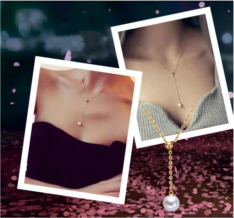 adjustable pearl lariat necklace in gold tone featuring a delicate chain with a single pearl pendant hanging from the center.