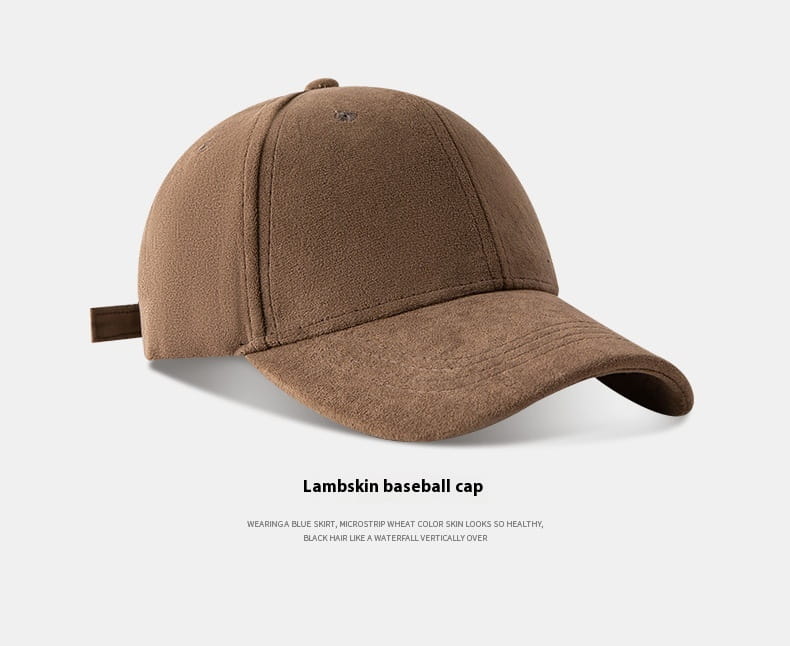 A brown lambskin suede baseball cap with a soft textured finish and a curved brim in a minimalist adjustable design.