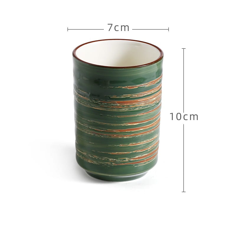 A green ceramic Japanese ceramic mug with horizontal rust-colored stripes and a white interior designed as a retro hand-painted tea cup with 250ml capacity.