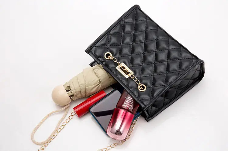 Black quilted leather mini crossbody bag with gold-tone chain strap and rhombus clasp for elegant shoulder wear
