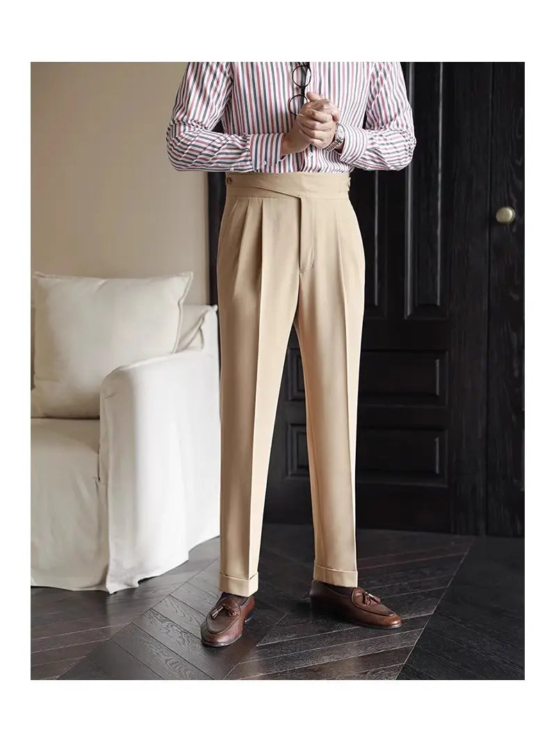 Beige tailored pleated wool trousers with a straight leg fit and belt loops for men.