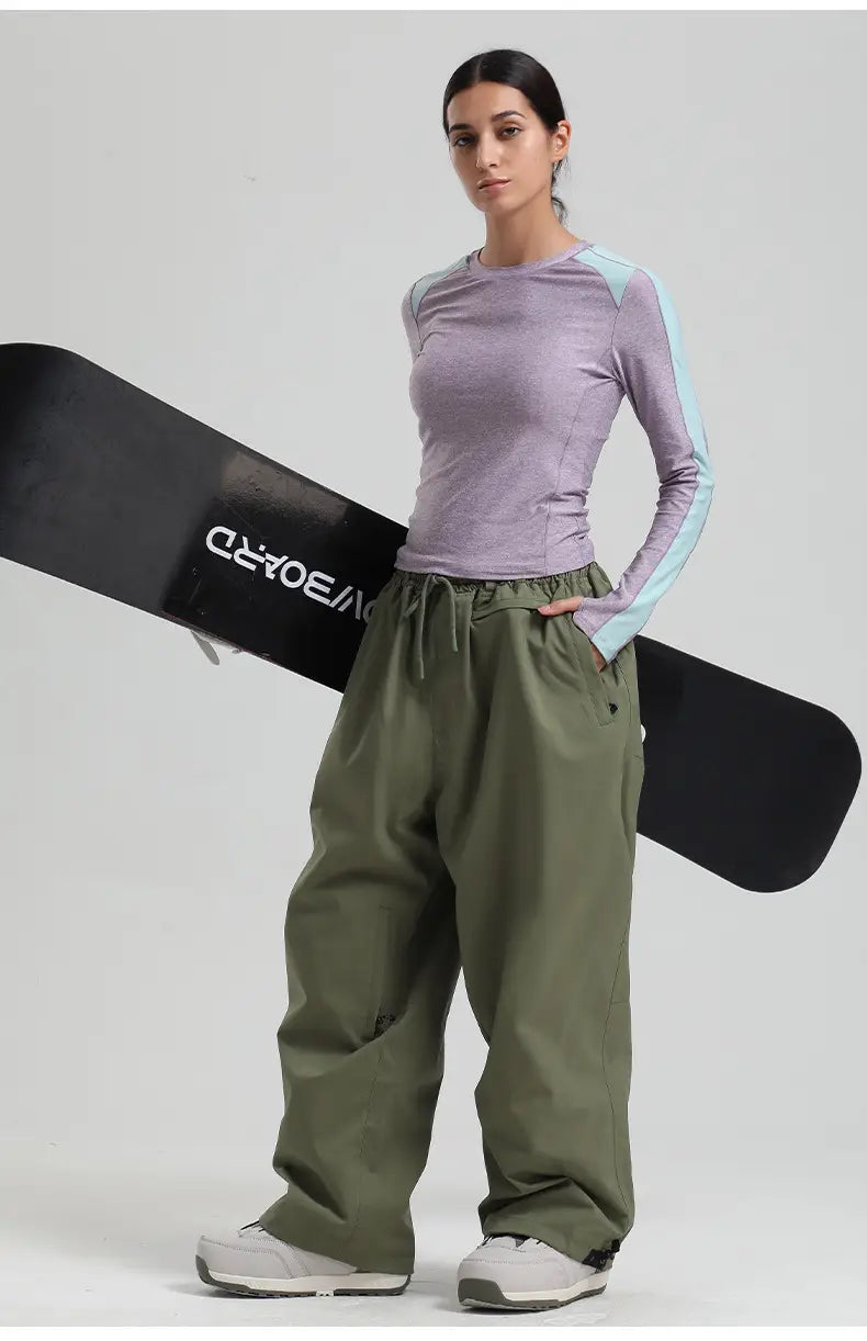 Olive green waterproof windproof snow pants with a drawstring waist and side pockets designed for loose work trousers and snowboarding.