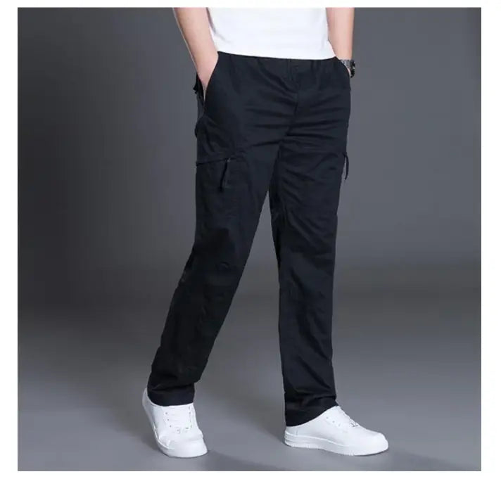 Men’s relaxed fit cargo pants in black pure cotton with multiple pockets for utility and comfort
