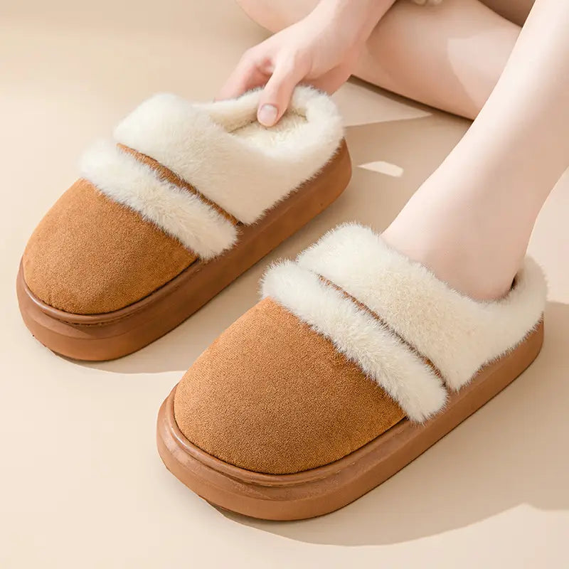 Women’s plush tan suede slip-on slippers with thick cushioned sole and white faux fur lining for winter indoor use
