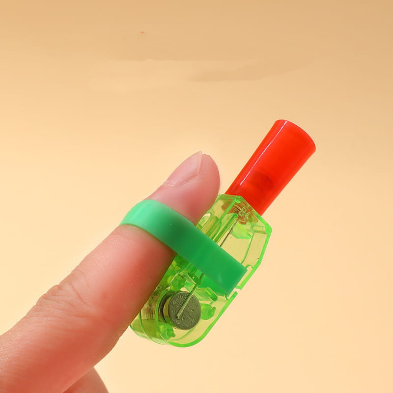 green plastic finger-mounted pencil sharpener with red cylindrical top and visible battery compartment shown with cartoon finger projection lamp luminous toy 10 pack