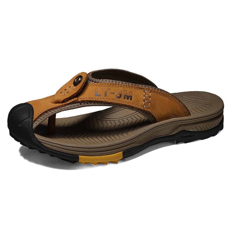 Men’s leather beach sandals outdoor sport flip flops in tan leather with a black rubber toe cap and sole featuring a textured footbed and stitched detailing.
