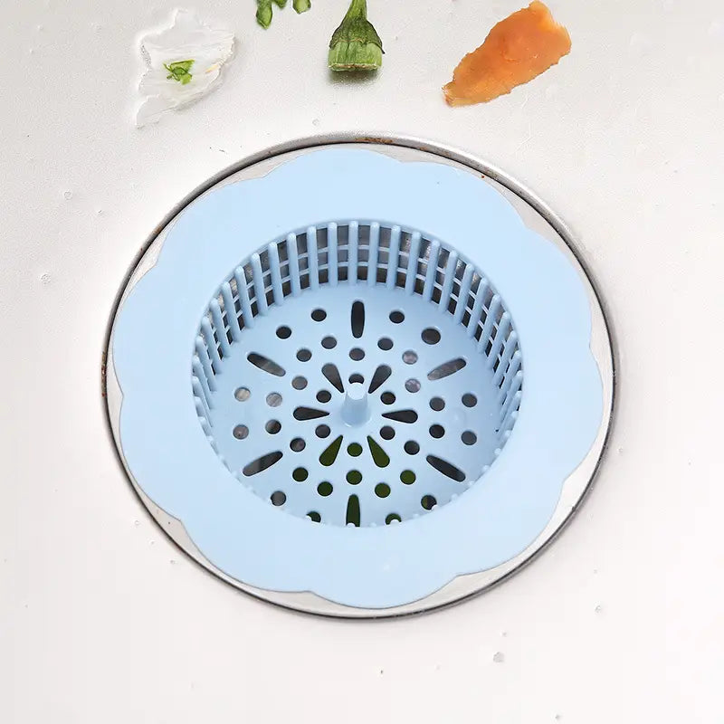Hellblauer Silikon-Blumen-Siphonfilter mit gezacktem Rand und perforiertem Design als Küchenablauf-Filter für den Abflussstöpsel, 4er-Pack.