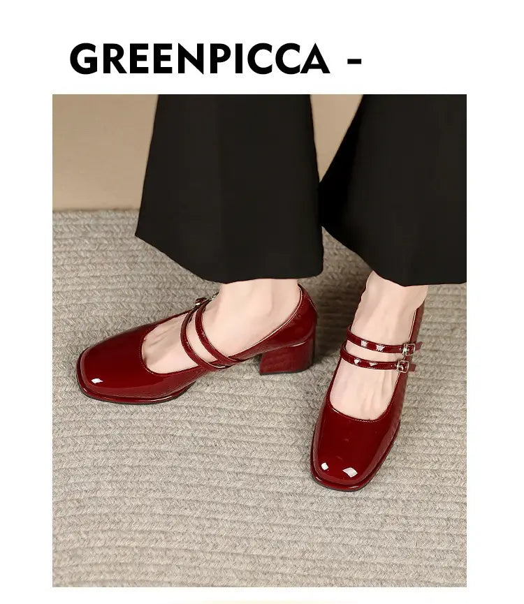 Burgundy patent leather mary jane double strap block heels with a square toe and low block heel featuring two adjustable straps across the instep.