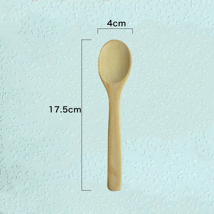 A light-colored wooden spoon with a smooth natural finish and rounded bowl from a wooden spoon set natural eco-friendly kitchen utensils.
