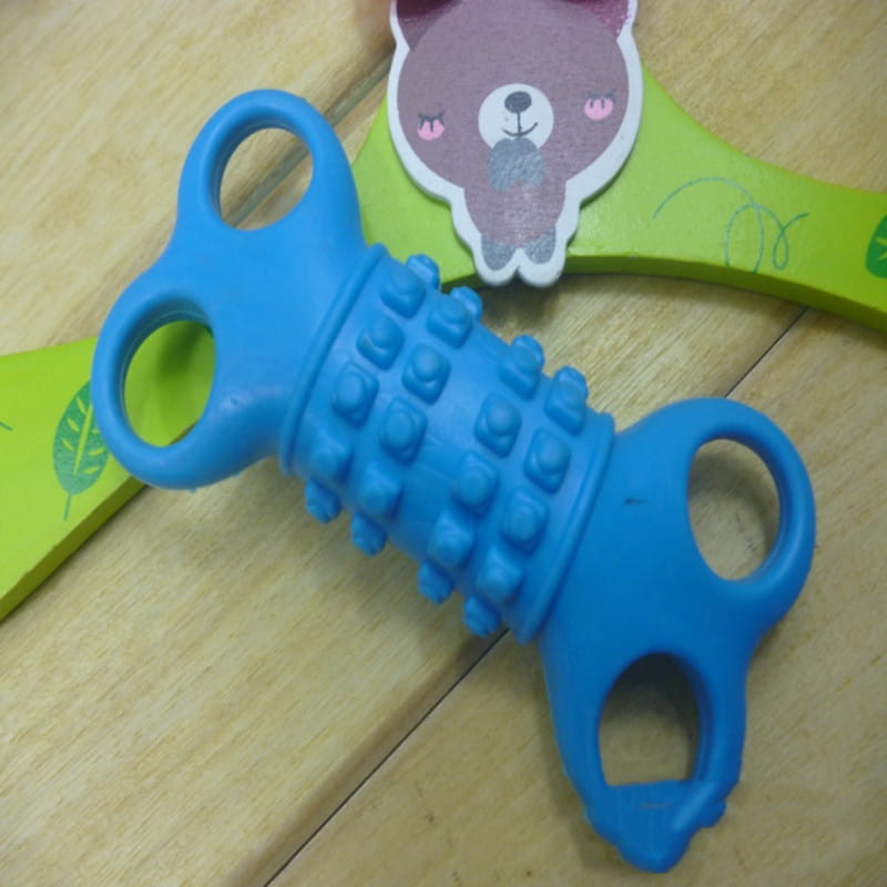 Blue silicone bone dog chew toy with textured raised bumps and two handle loops for easy grip