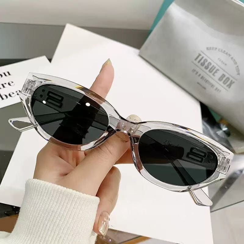 Clear acetate retro cat eye uv400 sunglasses with dark gray lenses and glossy modern frames.