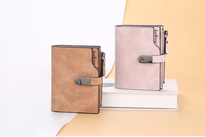 women’s short faux leather multi slot wallets in tan and light pink with silver-toned buckle closure and zipper detailing
