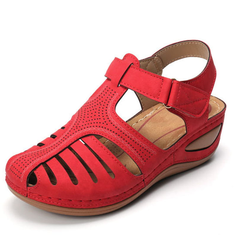 Red suede wedge sandal with perforated and slotted design in retro plus size women’s T-strap shoes.