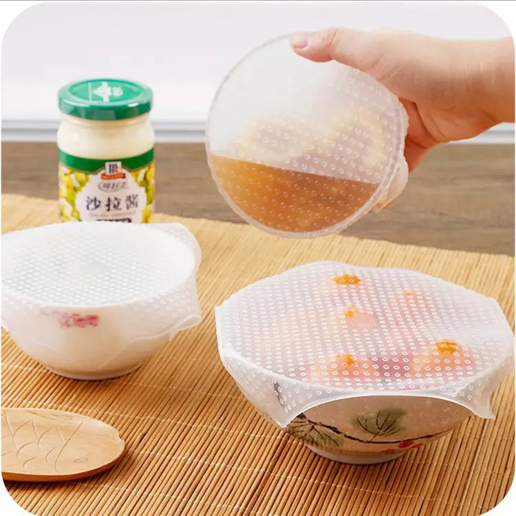 Couvre-bols en silicone transparent avec une surface texturée à points, issus des couvercles extensibles en silicone réutilisables pour la conservation des aliments, lot de 4, conçus pour une conservation sécurisée des aliments.