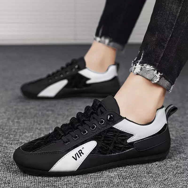 Men’s low top quilted athletic fashion sneakers in black and white featuring a textured pattern on the side panel with vir branding in black lettering.