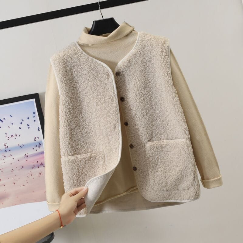 Cream-colored shearling vest with soft textured fleece exterior and matching inner lining designed as plush fleece vest women cozy winter outerwear.