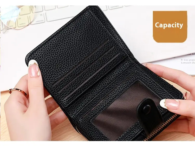 Black textured leather mini organ wallet with button closure featuring multiple card slots and a transparent ID window.