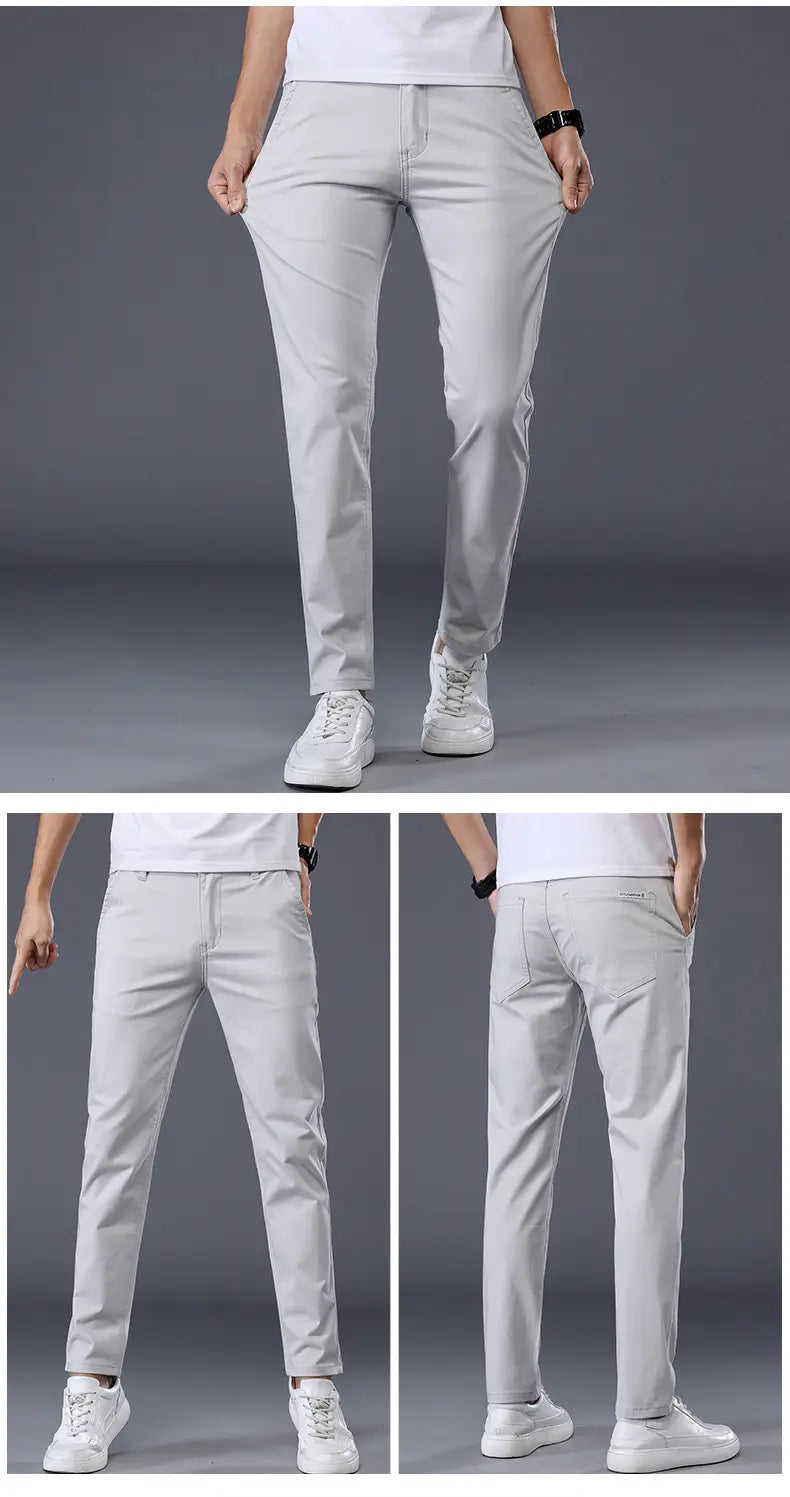 Herren-Chinohosen aus elastischer Baumwolle in Hellgrau, Slim Fit, mit geradem Schnitt und dezenten Nähtdetails.