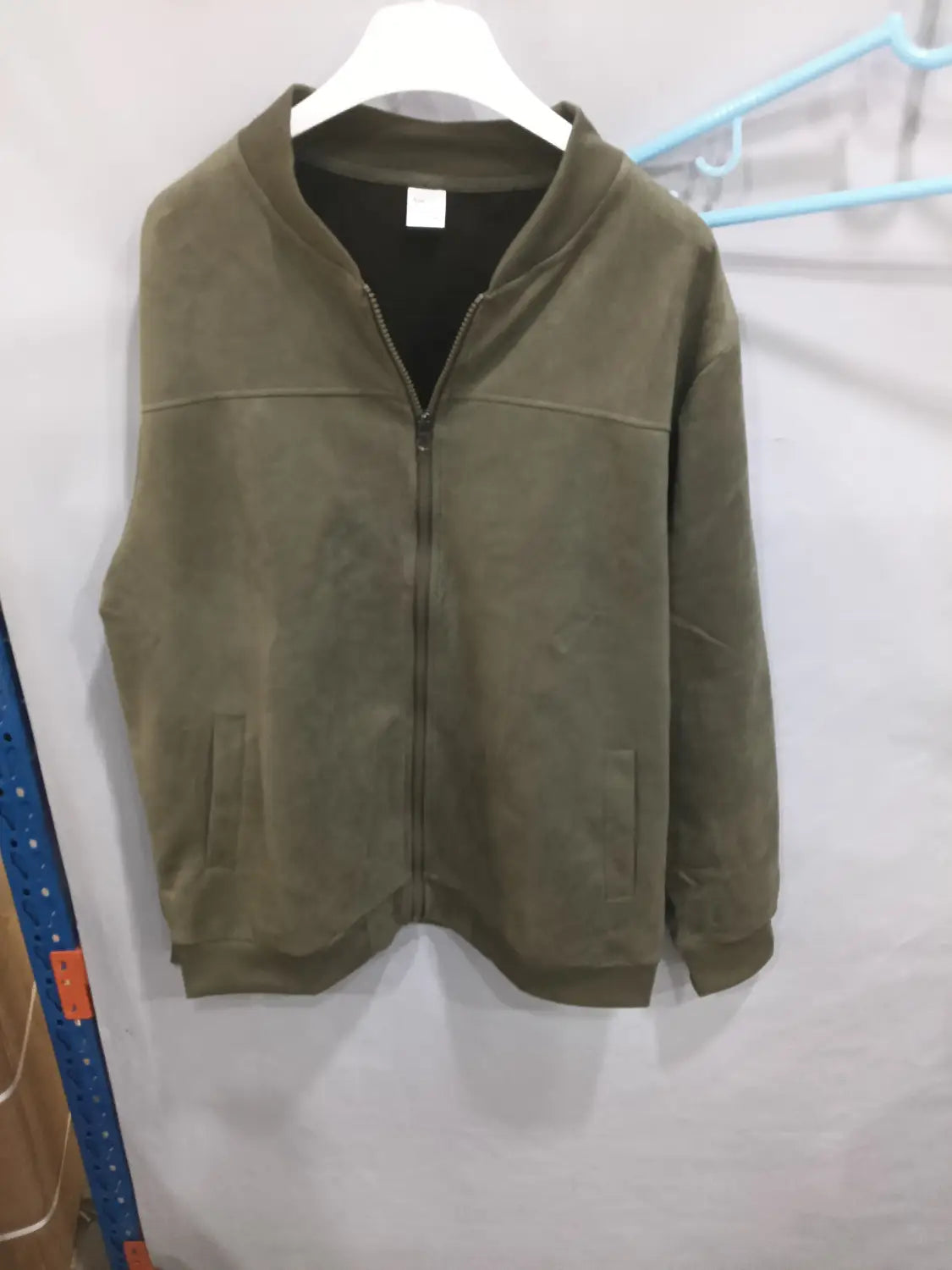Men suede casual retro jacket in olive green suede with a black inner lining and two front pockets.