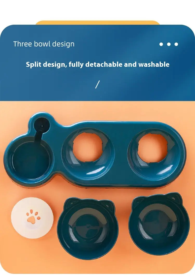 Distributeur orthopédique pour chat avec gamelle d’eau automatique intégrée dans une teinte turquoise, comprenant une station d’alimentation détachable avec trois bols et des plats latéraux en forme d’oreilles de chat.