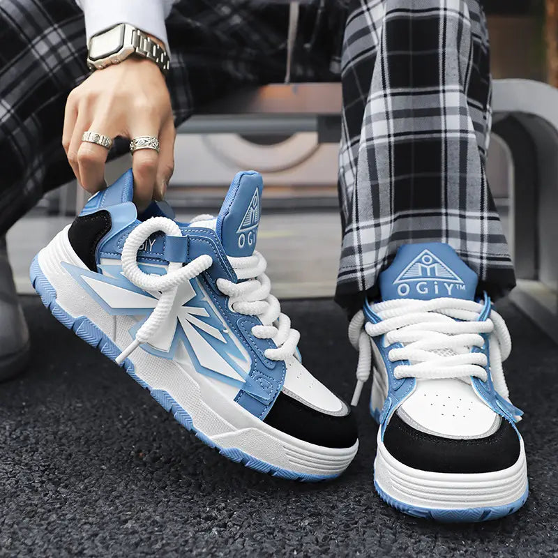 Chunky sneakers for men Harajuku low top shoes in light blue and white with black accents featuring a bold geometric design and a textured rubber sole.