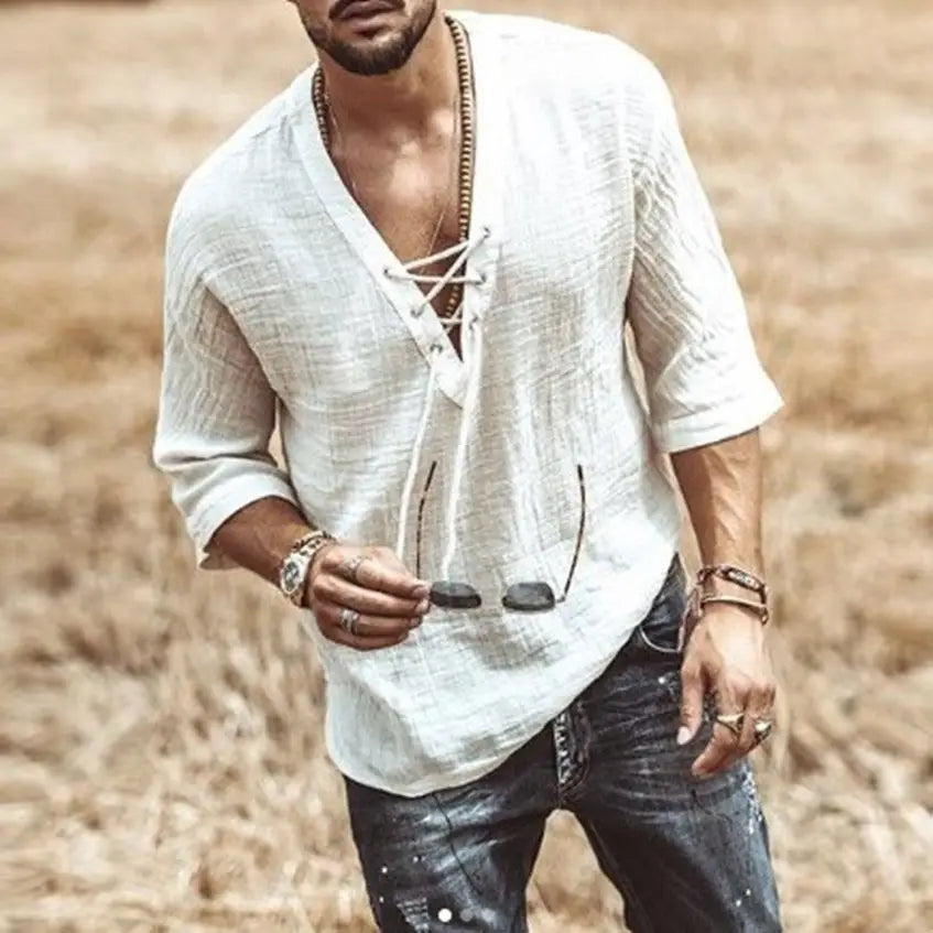 White linen shirt with a v-neck and lace-up front featuring textured fabric for a stylish casual look.