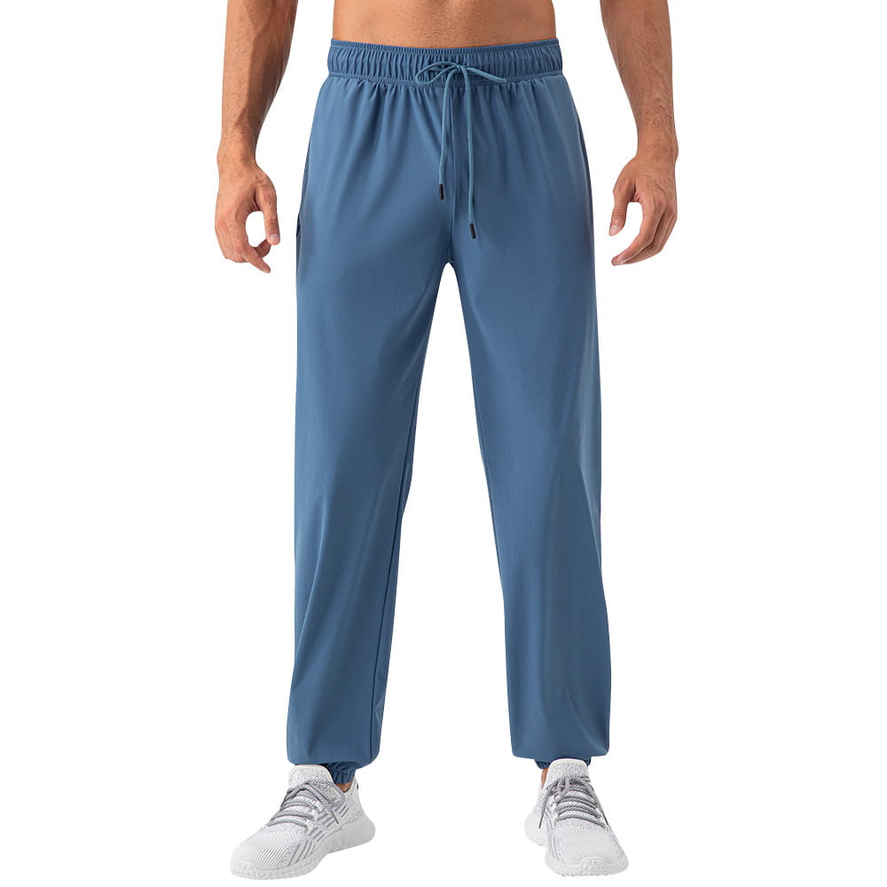 men’s quick dry nylon loose fit athletic track pants in blue featuring an elastic waistband and drawstring made from smooth lightweight fabric.