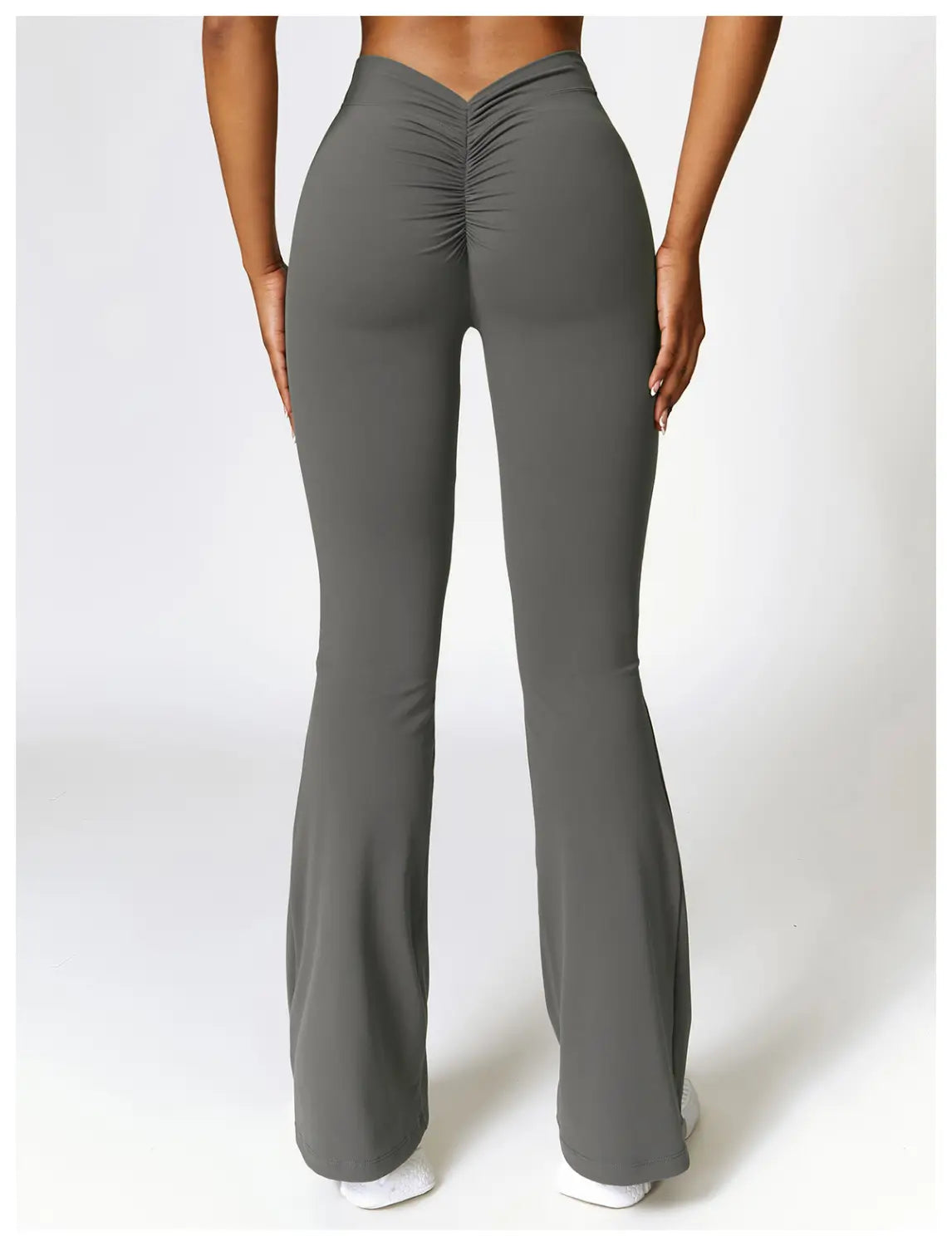 Gray high-waist flared yoga pants active trousers with a ruched back design shown from the back side.