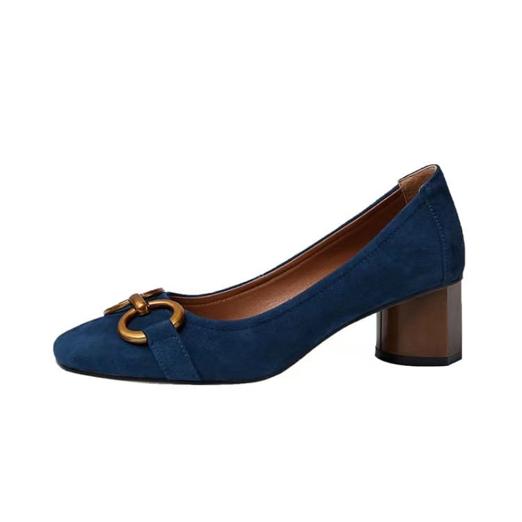 Navy blue suede square toe leather pump with a gold-toned circular buckle and block heel.