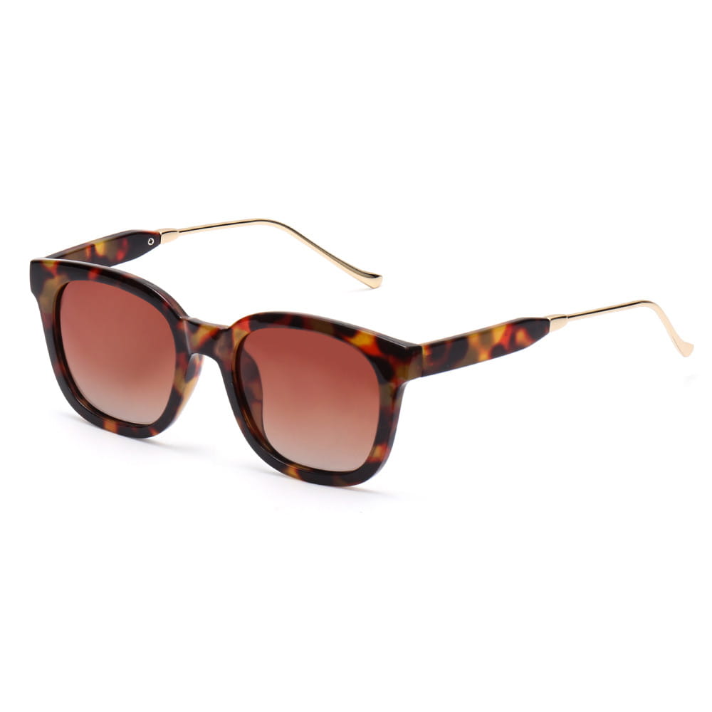 Lunettes de soleil carrées polarisées pour femme en acétate écaille de tortue, avec branches métalliques ton sur ton doré et verres dégradés bruns.