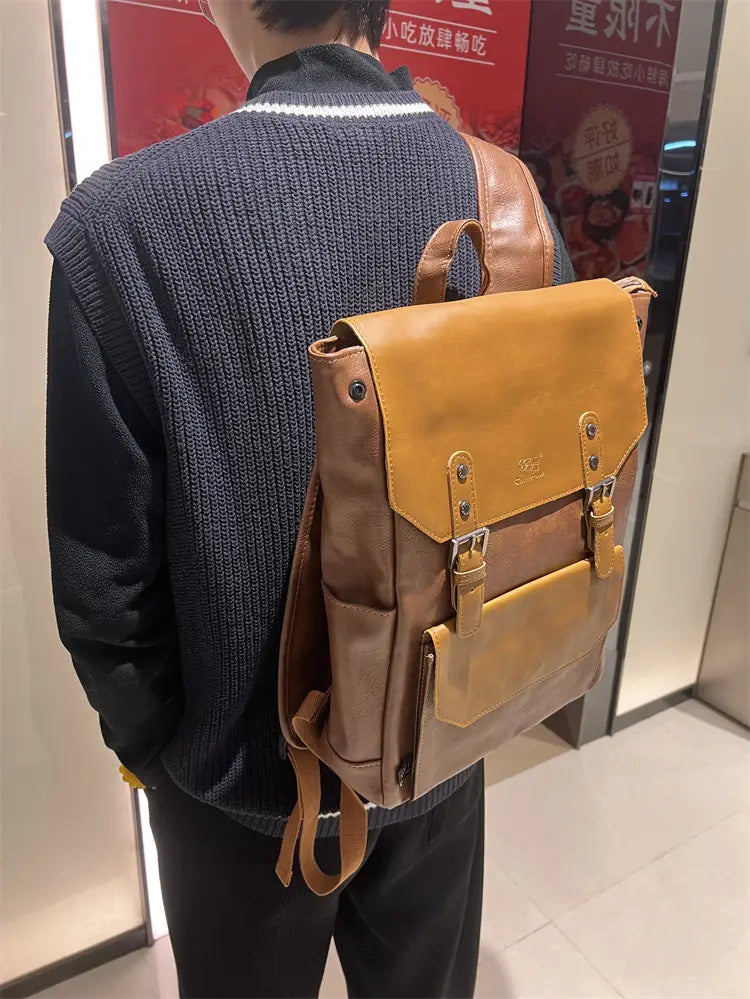 Tan leather vintage college backpack with brown accents and large capacity suitable for travel use