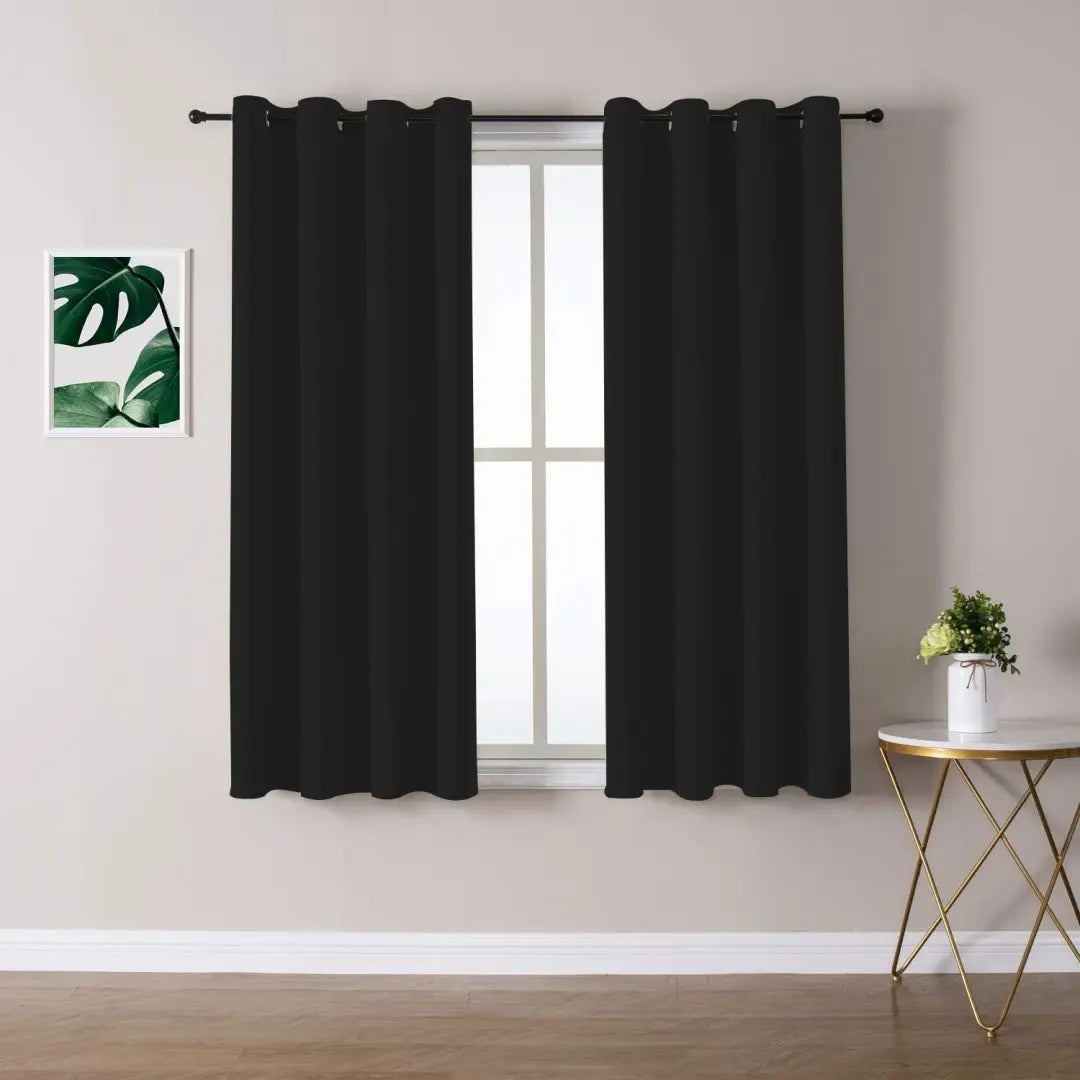 Black blackout curtains 3 layer grommet pair with smooth solid fabric finish measuring 132cm by 114cm