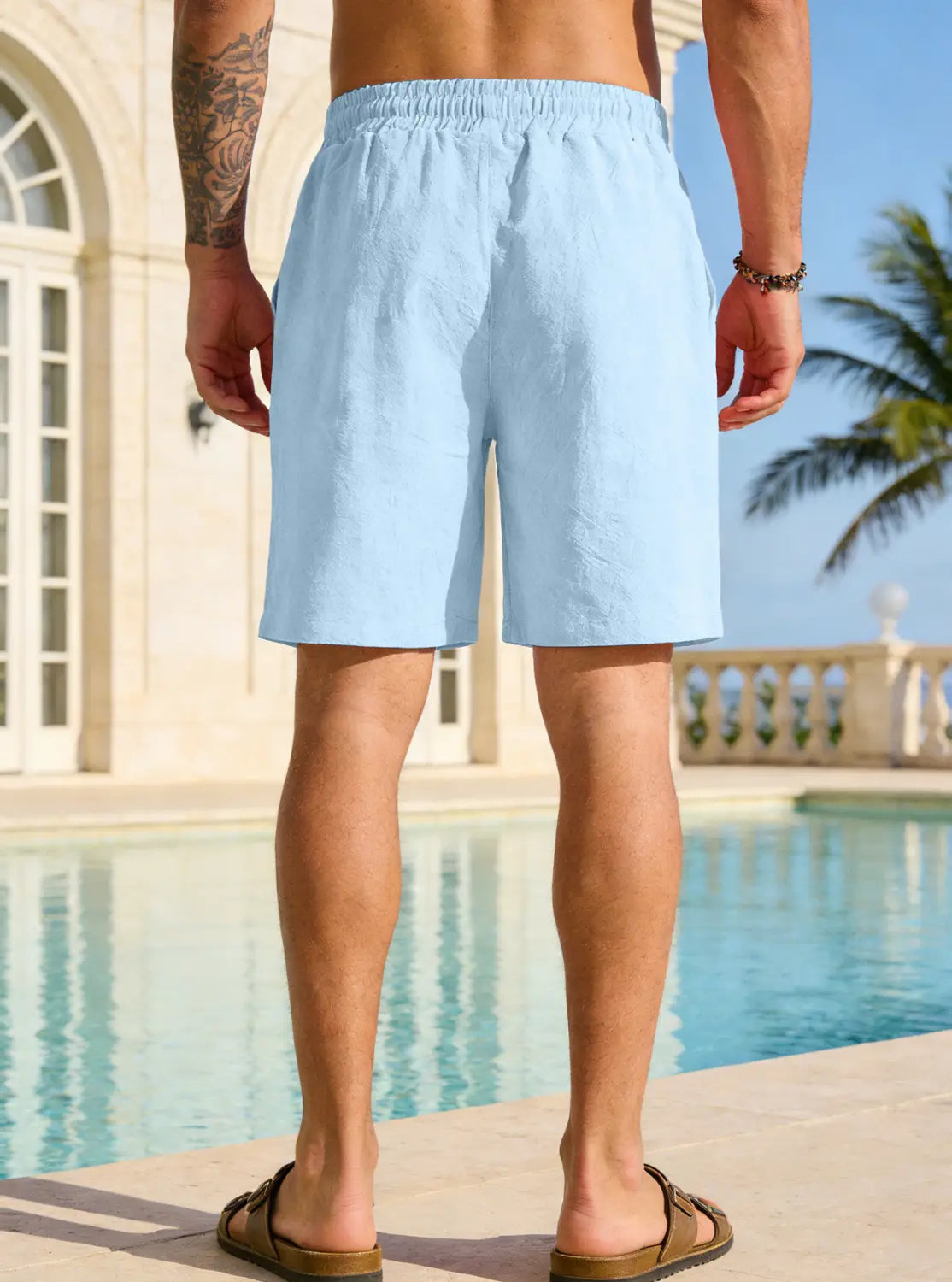 mens cotton linen drawstring shorts in light blue breathable linen fabric with an elastic waistband