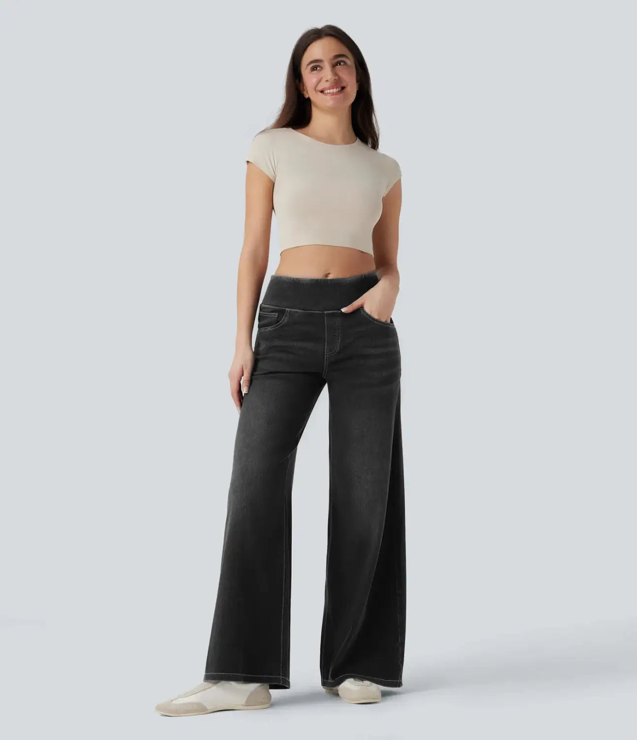Black wide leg stretchy high waisted jeans made of denim with subtle fading and a high waist design.