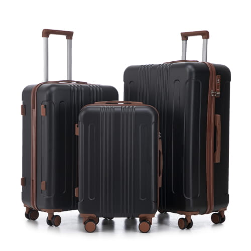 Set of three black hard-shell abs spinner luggage suitcases with brown leather accents retractable handles and tsa lock.