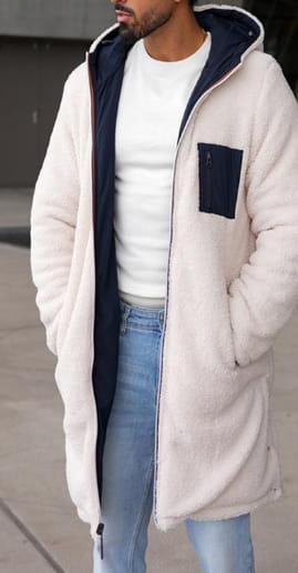 Men reversible shearling winter hooded coat in cream color with fleece lining, navy blue inner lining, and matching pocket.