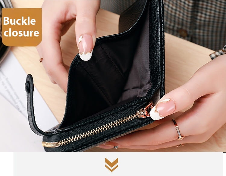 Black leather mini organ wallet with button closure featuring a gold-toned zipper and buckle closure.