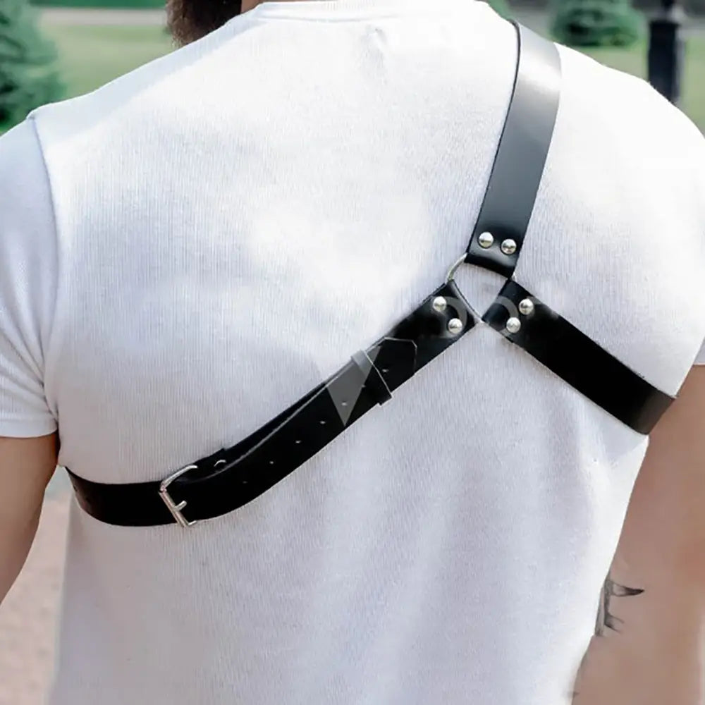 Black leather studded dance harness featuring silver-toned metal buckles and studs.