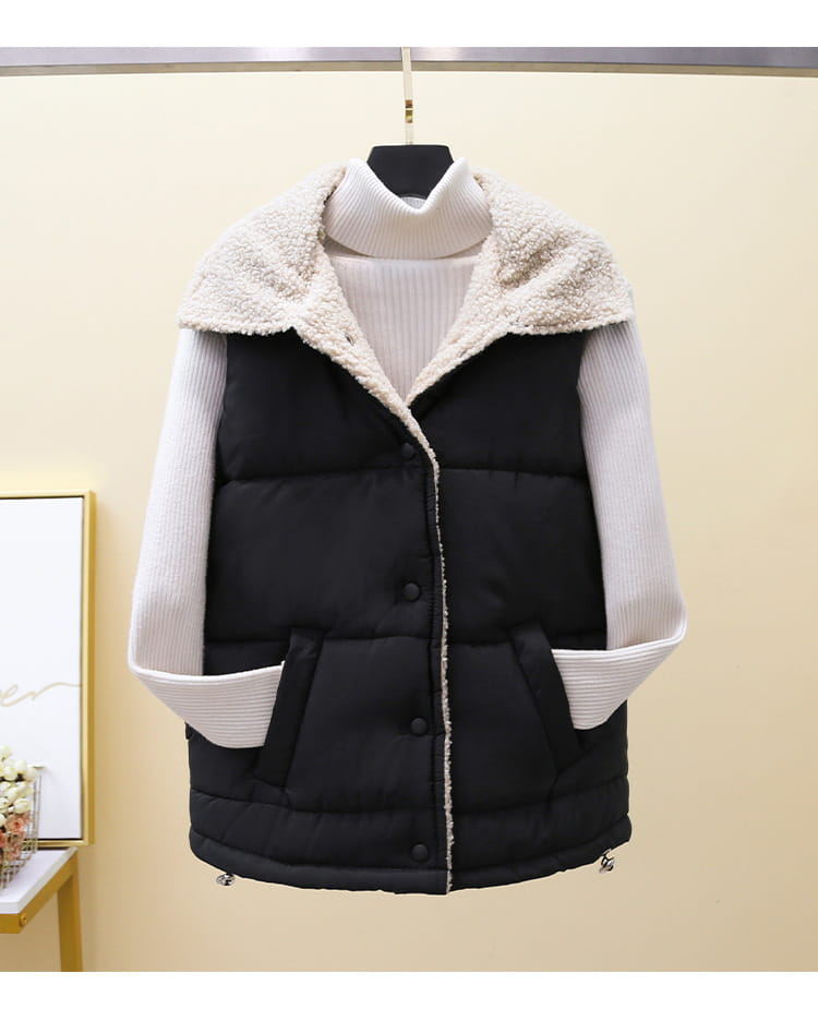 black quilted vest with plush cream-colored fleece collar and ribbed white long sleeves in a mint green quilted shearling vest for women product.